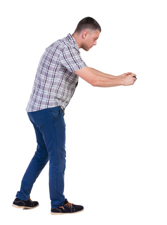 Back view of man photographing. tourist with camera. Rear view people collection.  backside view of person.  Isolated over white background.の写真素材