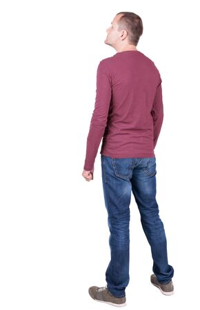 Back view of young man in t-shirt and jeans  looking.   Standing young guy. Rear view people collection.  backside view of person.  Isolated over white background.の写真素材