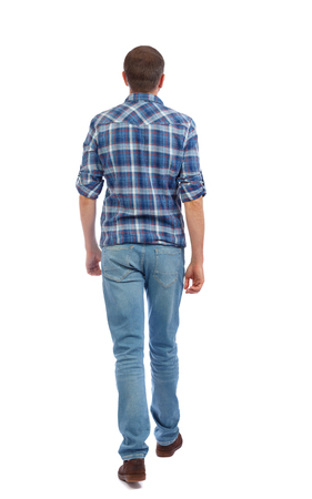 Back view of going  handsome man. walking young guy . Rear view people collection.  backside view of person.  Isolated over white background. A man in a blue shirt goes away.の写真素材