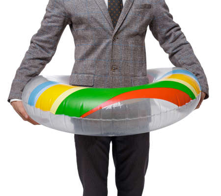 Front view of businessman with an inflatable circle. Isolated over white background. Business...