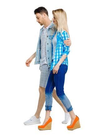 Side view of going couple. walking friendly girl and guy holding hands. Rear view people collection. backside view of person. Isolated over white background.の写真素材