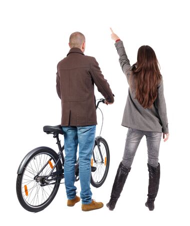 Back view of couple in winter jacket. man on a bicycle and a woman. Rear view people collection. backside view of person. Isolated over white background.の写真素材
