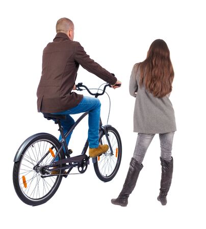 Back view of couple in winter jacket. man on a bicycle and a woman. Rear view people collection. backside view of person. Isolated over white background.の写真素材