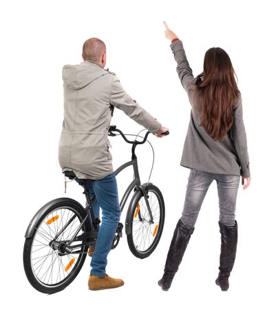 Back view of couple in winter jacket. man on a bicycle and a woman. Rear view people collection. backside view of person. Isolated over white background.の写真素材