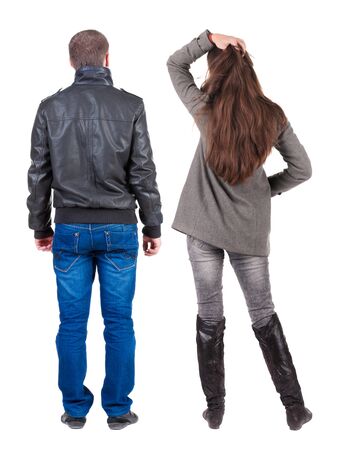 Back view of couple in winter jacket. beautiful friendly girl and guy together. Rear view people collection. backside view of person. Isolated over white background.の写真素材