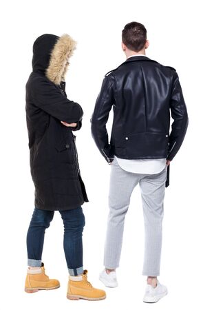 Back view of couple in winter jacket. beautiful friendly girl and guy together. Rear view people collection. backside view of person. Isolated over white background.の写真素材