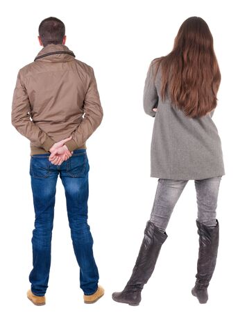 Back view of couple in winter jacket. beautiful friendly girl and guy together. Rear view people collection. backside view of person. Isolated over white background.の写真素材
