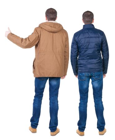 Back view of two man in winter jacket showing thumb up. Rear view people collection. backside view of person. Isolated over white background.の写真素材