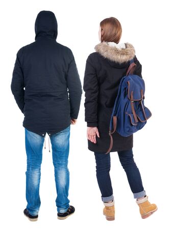 Back view of couple in winter jacket. beautiful friendly girl and guy together. Rear view people collection. backside view of person. Isolated over white background.の写真素材
