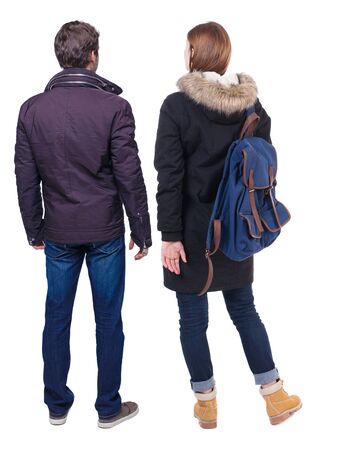 Back view of couple in winter jacket. beautiful friendly girl and guy together. Rear view people collection. backside view of person. Isolated over white background.の写真素材