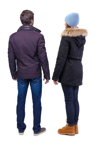 Back view of couple in winter jacket. beautiful friendly girl and guy together. Rear view people collection. backside view of person. Isolated over white background.の写真素材