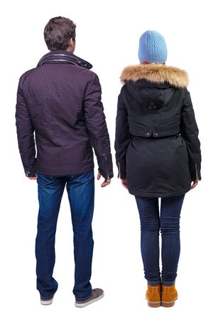 Back view of couple in winter jacket. beautiful friendly girl and guy together. Rear view people collection. backside view of person. Isolated over white background.の写真素材