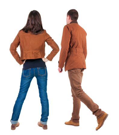 Back view of couple in winter jacket. beautiful friendly girl and guy together. Rear view people collection. backside view of person. Isolated over white background.の写真素材