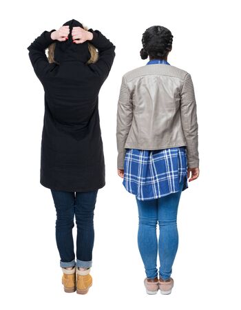 Back view of couple couple in winter jackets pointing. beautiful friendly girl and guy together. Rear view people collection. backside view of person. Isolated over white background.の写真素材
