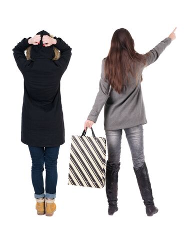 back view of couple with shopping bags. backside view of person. Rear view people collection. Isolated over white background.の写真素材