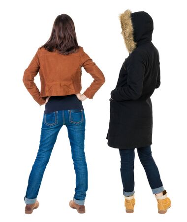 Back view of couple couple in winter jackets pointing. beautiful friendly girl and guy together. Rear view people collection. backside view of person. Isolated over white background.の写真素材