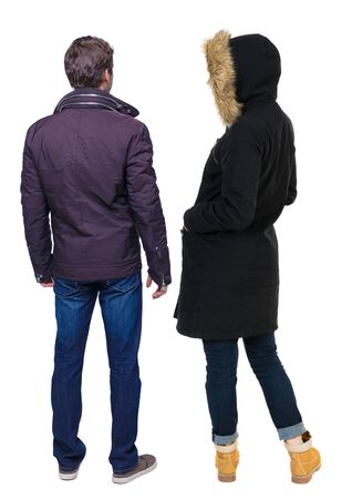 Back view of couple in winter jacket. beautiful friendly girl and guy together. Rear view people collection. backside view of person. Isolated over white background.の写真素材