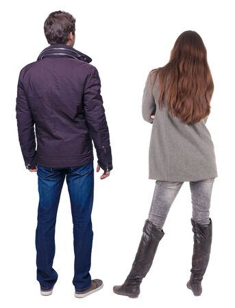 Back view of couple in winter jacket. beautiful friendly girl and guy together. Rear view people collection. backside view of person. Isolated over white background.の写真素材