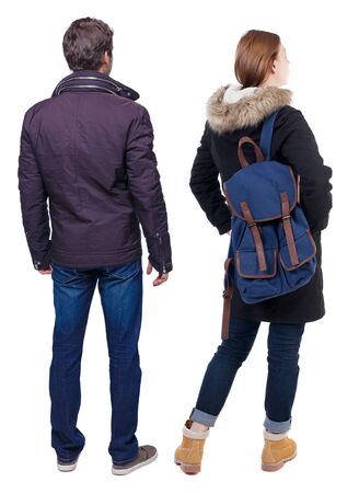 Back view of couple in winter jacket. beautiful friendly girl and guy together. Rear view people collection. backside view of person. Isolated over white background.の写真素材