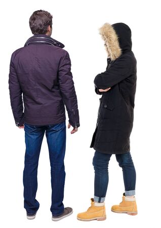 Back view of couple in winter jacket. beautiful friendly girl and guy together. Rear view people collection. backside view of person. Isolated over white background.の写真素材
