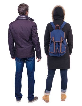 Back view of couple in winter jacket. beautiful friendly girl and guy together. Rear view people collection. backside view of person. Isolated over white background.の写真素材