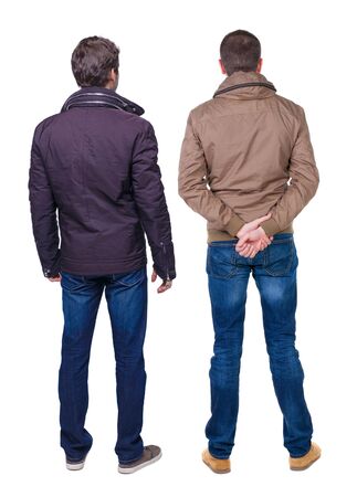 Back view of couple in winter jacket. beautiful friendly girl and guy together. Rear view people collection. backside view of person. Isolated over white background.の写真素材