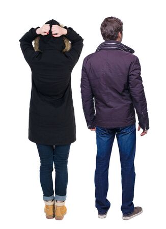 Back view of couple in winter jacket. beautiful friendly girl and guy together. Rear view people collection. backside view of person. Isolated over white background.の写真素材