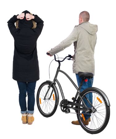Back view of couple in winter jacket. man on a bicycle and a woman. Rear view people collection. backside view of person. Isolated over white background.の写真素材