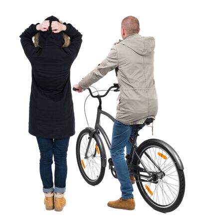 Back view of couple in winter jacket. man on a bicycle and a woman. Rear view people collection. backside view of person. Isolated over white background.の写真素材
