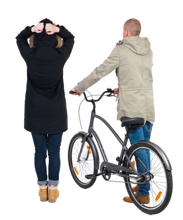Back view of couple in winter jacket. man on a bicycle and a woman. Rear view people collection. backside view of person. Isolated over white background.の写真素材