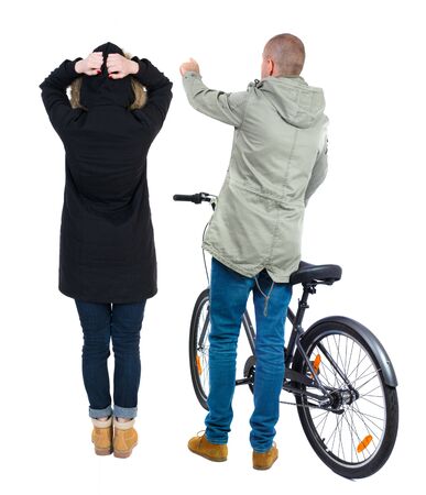 Back view of couple in winter jacket. man on a bicycle and a woman. Rear view people collection. backside view of person. Isolated over white background.の写真素材