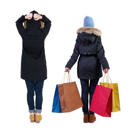 back view of couple with shopping bags. backside view of person. Rear view people collection. Isolated over white background.の写真素材