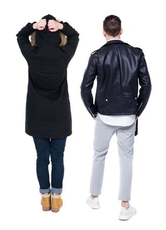 Back view of couple in winter jacket. beautiful friendly girl and guy together. Rear view people collection. backside view of person. Isolated over white background.の写真素材