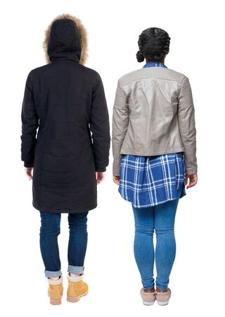 Back view of couple couple in winter jackets pointing. beautiful friendly girl and guy together. Rear view people collection. backside view of person. Isolated over white background.の写真素材
