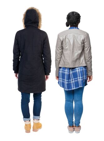 Back view of couple couple in winter jackets pointing. beautiful friendly girl and guy together. Rear view people collection. backside view of person. Isolated over white background.の写真素材