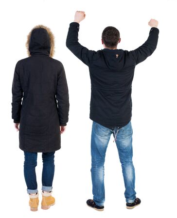 Back view of couple in winter jacket. beautiful friendly girl and guy together. Rear view people collection. backside view of person. Isolated over white background.の写真素材
