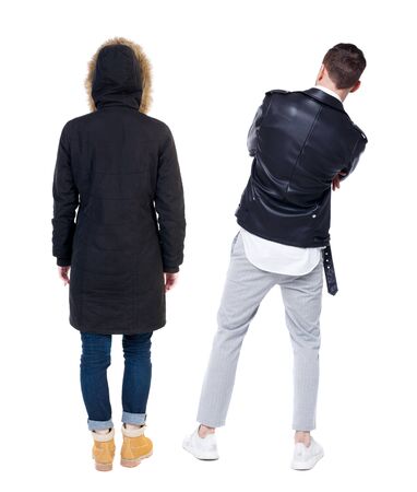 Back view of couple in winter jacket. beautiful friendly girl and guy together. Rear view people collection. backside view of person. Isolated over white background.の写真素材