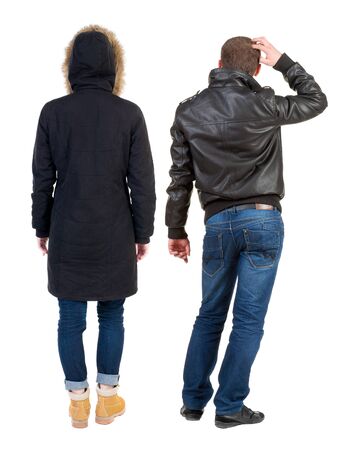 Back view of couple in winter jacket. beautiful friendly girl and guy together. Rear view people collection. backside view of person. Isolated over white background.の写真素材