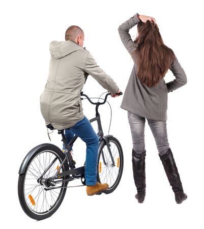 Back view of couple in winter jacket. man on a bicycle and a woman. Rear view people collection. backside view of person. Isolated over white background.の写真素材