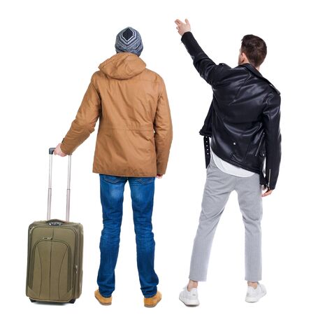 Back view of two man in winter jacket traveling with suitcas. Back view. Rear view people collection. backside view of person. Isolated over white background.の写真素材
