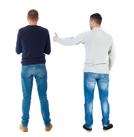 Back view of two man in sweater showing thumb up. Rear view people collection. backside view of person. Isolated over white background.の写真素材