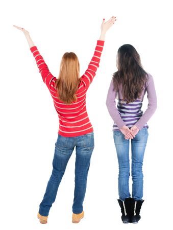 Back view of couple couple in sweater pointing. beautiful friendly girl and guy together. Rear view people collection. backside view of person. Isolated over white background.の写真素材