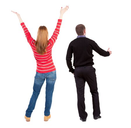 Back view of couple couple in sweater showing thumbs up. beautiful friendly girl and guy together. Rear view people collection. backside view of person. Isolated over white background.の写真素材