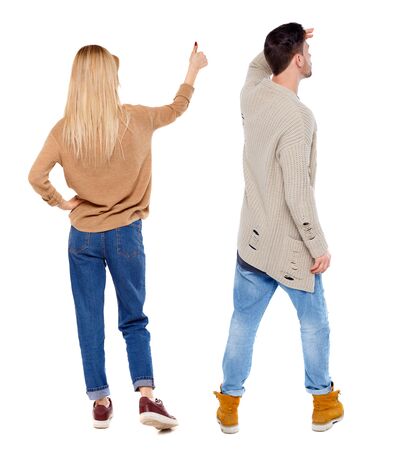 Back view of couple couple in sweater showing thumbs up. beautiful friendly girl and guy together. Rear view people collection. backside view of person. Isolated over white background.の写真素材