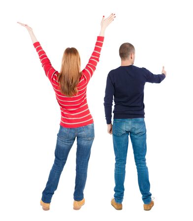 Back view of couple couple in sweater showing thumbs up. beautiful friendly girl and guy together. Rear view people collection. backside view of person. Isolated over white background.の写真素材