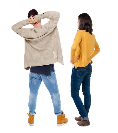 Back view of couple in sweater. beautiful friendly girl and guy together. Rear view people collection. backside view of person. Isolated over white background.の写真素材