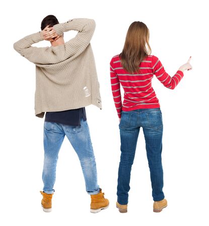 Back view of couple couple in sweater showing thumbs up. beautiful friendly girl and guy together. Rear view people collection. backside view of person. Isolated over white background.の写真素材