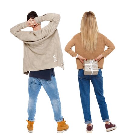 Back view of couple in sweater. beautiful friendly girl and guy together. Rear view people collection. backside view of person. Isolated over white background.の写真素材