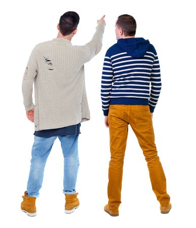 Back view of two man in sweater pointing. Rear view people collection. backside view of person. Isolated over white background.の写真素材