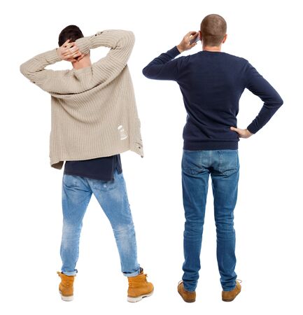 Back view of two man in sweater with mobile phone. Rear view people collection. backside view of person. Isolated over white background.の写真素材